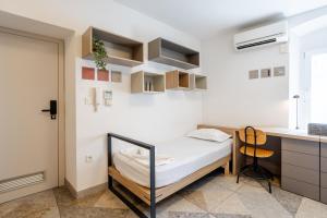 a small room with a bed and a desk at Casa Riccobon in Koper +50 photos
