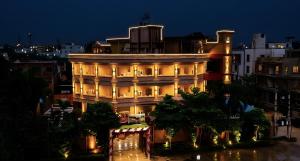a building lit up at night with lights at Buddha Heritage in Patna