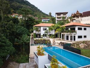 an aerial view of a house with a swimming pool at Baan Chom View Kamala - SHA Plus in Kamala Beach