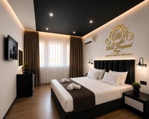 a bedroom with a bed with a sign on the wall at Hotel Beograd Struga in Struga +5 photos