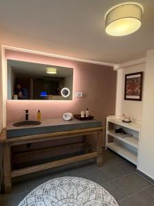 a bathroom with a sink and a mirror at Kirchstett in Sankt Wolfgang +15 photos
