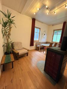 a large living room with a table and chairs at Naturblick in Neresheim