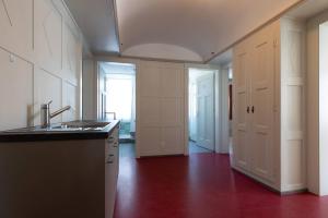 a kitchen with a sink and a counter top at Centrally Located Room in Buchs