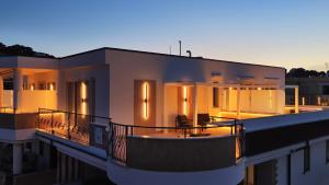 a building with a boat on the side of it at Manoli Luxury Rooms in Vieste