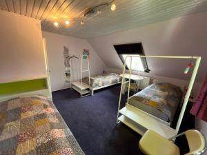 a room with two bunk beds in a room at Lüly in Lütjensee