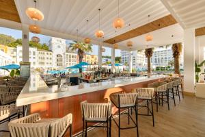 a restaurant with chairs and a bar with a view at Nirvana Dolce Vita - Ultra All Inclusive in Tekirova