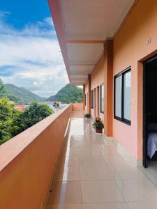 a balcony of a building with a view of the ocean at Thach An Hotel in Ðông Khê