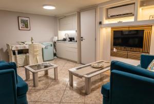 a living room with a couch and a table at Nonna Konstantina- old town center in Lefkada