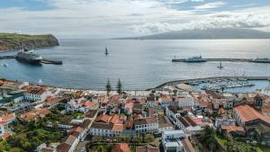 an aerial view of a town with boats in the water at GuestReady - Doctor House in Horta