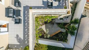 an overhead view of a building with a garden at GuestReady - Doctor House in Horta
