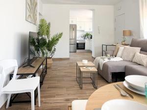a living room with a couch and a table at TAYP LaParra Homes in La Parra