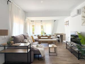 a living room with a couch and tables at TAYP LaParra Homes in La Parra