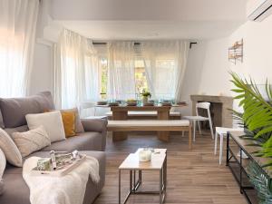 a living room with a couch and a table at TAYP LaParra Homes in La Parra