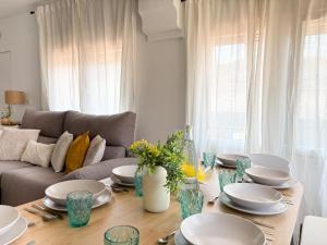 a living room with a table and a couch at TAYP LaParra Homes in La Parra +48 photos