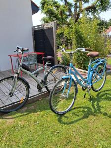 three bikes parked next to each other on the grass at Le Grand Chêne in Condette
