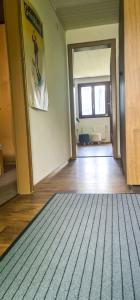 an empty room with a rug on the floor at Bussalp Apartment - Aare Jungfrau AG in Grindelwald