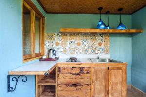 a kitchen with a sink and a counter top at Rama Phala Resort & Spa in Ubud +21 photos