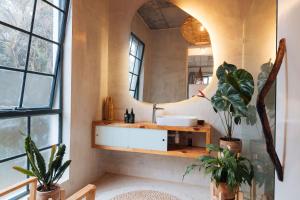 a bathroom with a sink and a mirror at Afrika House in Nairobi +35 photos