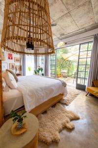 a bedroom with a large bed and a table at Afrika House in Nairobi