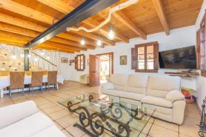 a living room with a couch and a table at Can Rosillo in Llucmajor