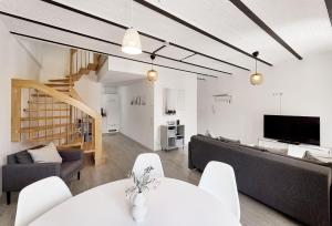 a living room with a couch and a table at Kenzingen Appartements zur Alten Brauerei in Kenzingen
