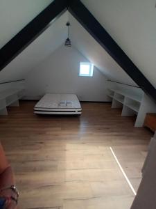 a mattress in the middle of a attic at mahuet florent in Bissy-sous-Uxelles