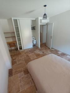 a bedroom with a bed and a tiled floor at mahuet florent in Bissy-sous-Uxelles +4 photos