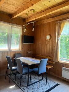 a dining room with a table and chairs at Weekendica in Kopaonik