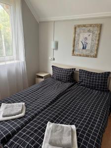 Postel nebo postele na pokoji v ubytování Centrum Hotel + 8 fotografií