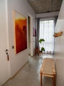 a room with a bench and a painting on the wall at Afrika House in Nairobi