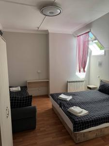 Postel nebo postele na pokoji v ubytování Centrum Hotel