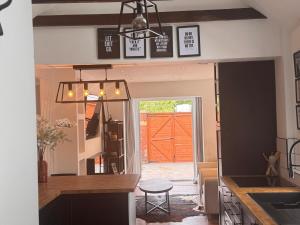 a kitchen with a counter and a door to a garage at Hesketh Hideaway 1 in Marshside