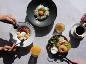 a group of people eating food on a table at BIRD HOTEL in Kamakura
