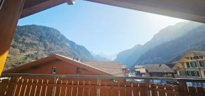 a balcony with a view of a mountain at Jungfrau Penthouse - Aare Jungfrau AG in Wilderswil