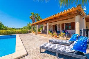 a house with a swimming pool and a patio at Can Gallu - Adults Only. in Moscari