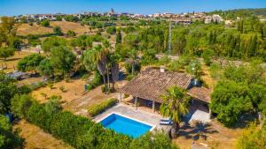 an aerial view of a house with a swimming pool at Can Gallu - Adults Only. in Moscari