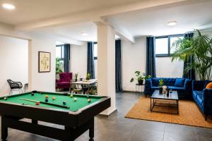 a living room with a pool table at PAME Wild in Athens