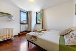 a bedroom with a large bed and a window at Casa Regina Salò in Salò