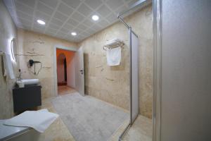 a bathroom with a shower and a sink at Diamond Village Ortahisar in Ürgüp +31 photos