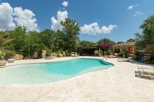 a swimming pool in a yard with a house at Estay - Tanca de Mar in Maracalagonis +103 photos