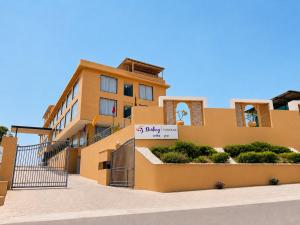 a building with a sign in front of it at Sterling Pushkar in Pushkar