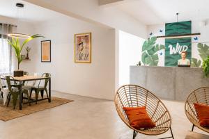a dining room with a table and chairs at PAME Wild in Athens