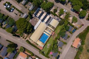 an overhead view of a building with a swimming pool at Kampaoh Estepona in Estepona