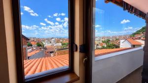 a window with a view of a city at Makadam Hotel in Prizren +43 photos