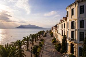 a street in front of a body of water at Thermae Sylla Spa & Wellness Hotel in Loutra Edipsou