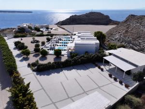 an aerial view of a resort near the ocean at Katharos Pool Villas in Oia