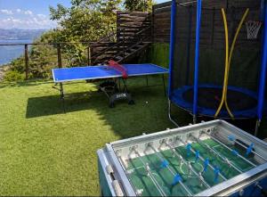 a blue ping pong table and a ping pong table at Dream House Tiberias in Tiberias