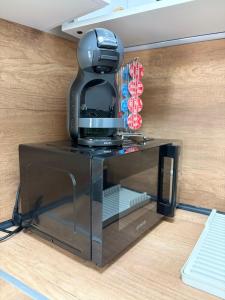 a coffee maker sitting on top of a counter at Little Studio Prespa Best Location in Varna City