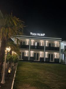 a building with a sign that reads tasha palmination at Casa Palma Villa in Velipojë