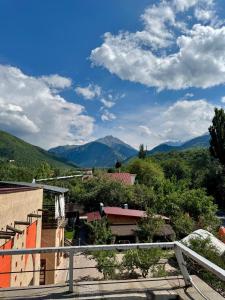 a view of the mountains from a building at Skala Hostel in Almaty